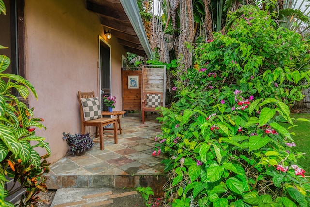 entrance to property featuring a patio