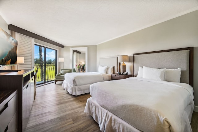 bedroom featuring a textured ceiling and light hardwood / wood-style floors