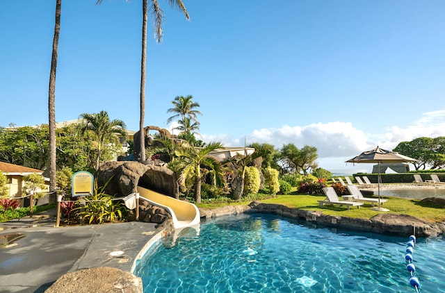 view of swimming pool featuring a water slide