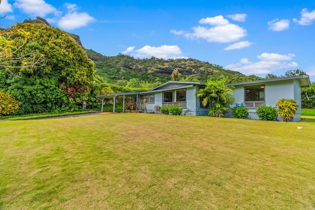 exterior space featuring a carport and a mountain view