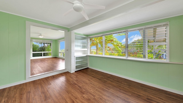 unfurnished sunroom featuring ceiling fan