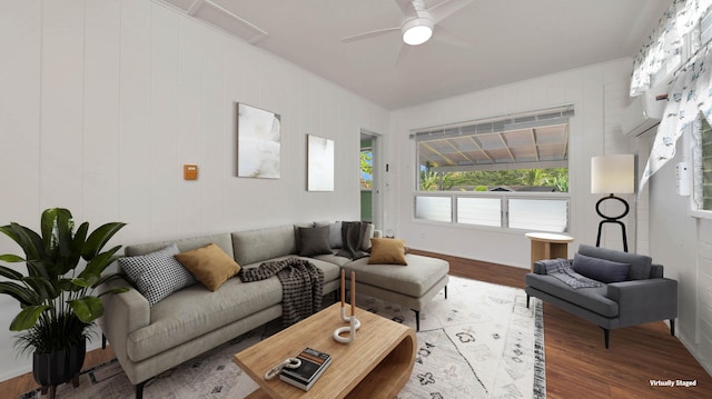 living room featuring ceiling fan, light hardwood / wood-style flooring, and ornamental molding