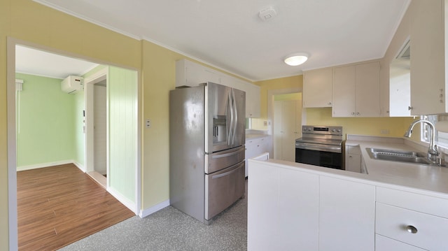 kitchen featuring sink, white cabinets, stainless steel appliances, and a wall mounted air conditioner