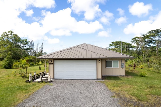 garage with a lawn