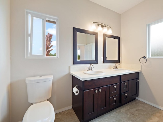 bathroom with toilet and vanity