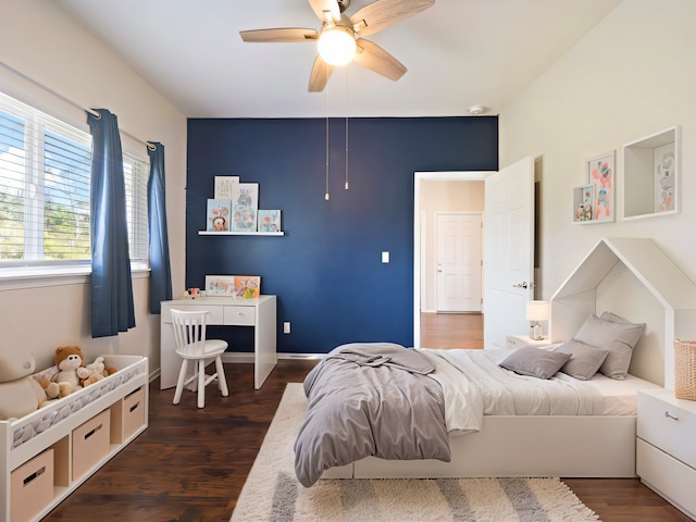 bedroom featuring ceiling fan and dark hardwood / wood-style floors