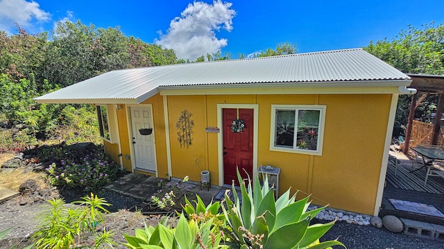 view of front of house with an outbuilding