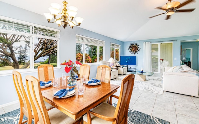 tiled dining room featuring vaulted ceiling and ceiling fan with notable chandelier