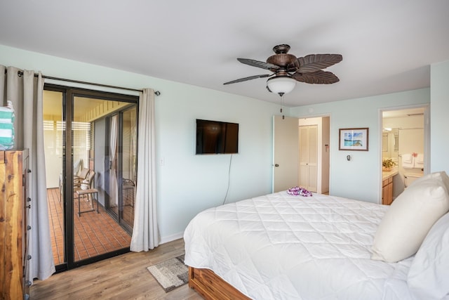 bedroom with ceiling fan, light hardwood / wood-style floors, and ensuite bath