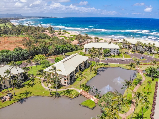 bird's eye view featuring a water view and a view of the beach