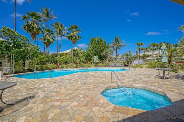 view of pool with a community hot tub