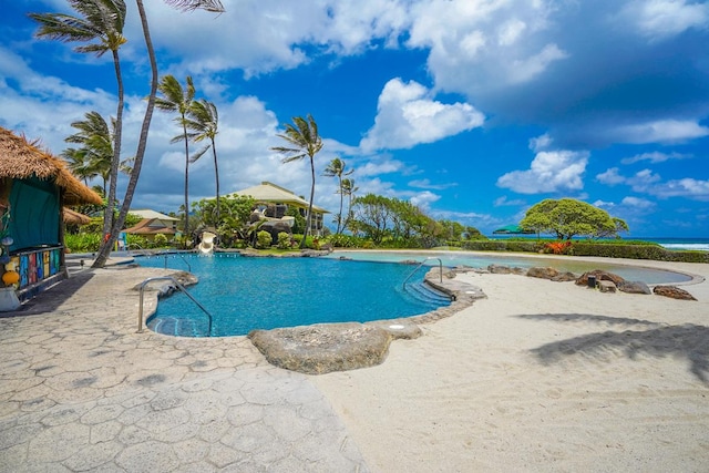 view of swimming pool featuring a patio area