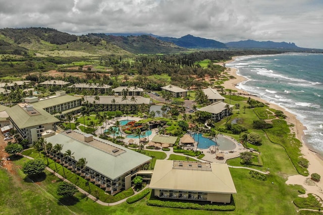 bird's eye view featuring a view of the beach and a water and mountain view