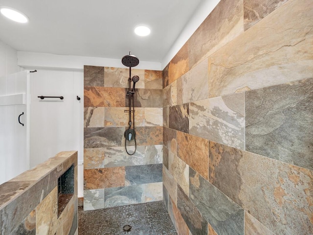 bathroom with tiled shower