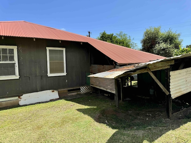 view of home's exterior with a yard