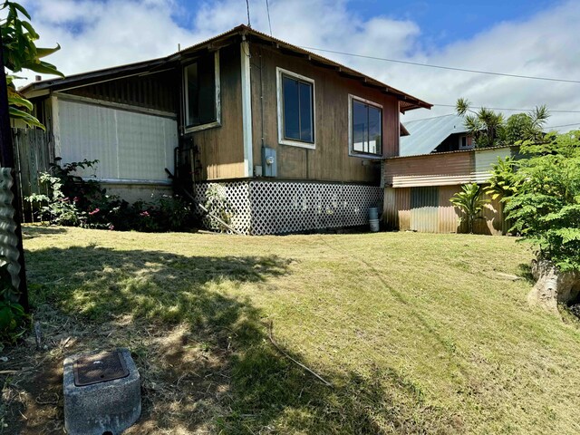 view of home's exterior with a lawn