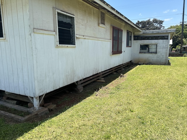 view of home's exterior with a lawn