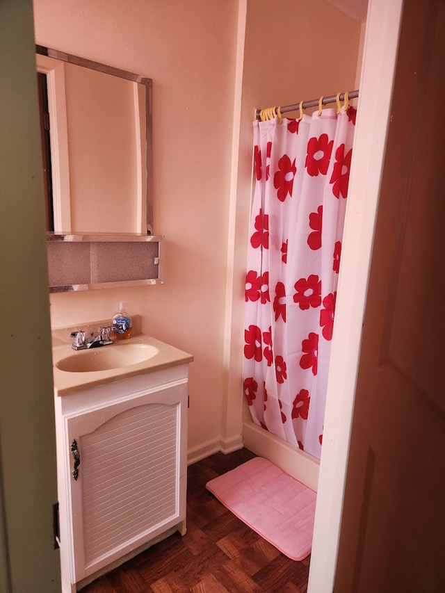 bathroom featuring shower / bathtub combination with curtain, vanity, and parquet floors