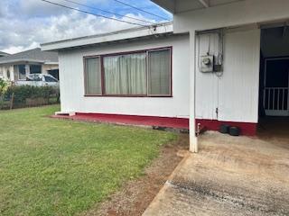 view of home's exterior with a lawn