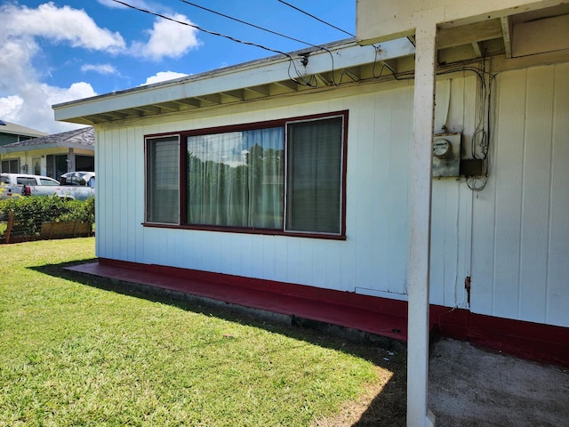 view of property exterior with a lawn