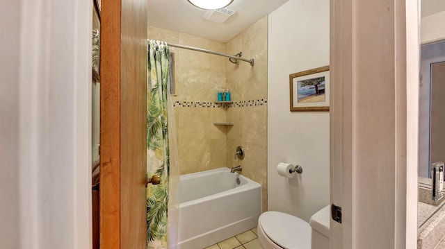 bathroom with toilet, tile patterned flooring, and shower / tub combo with curtain