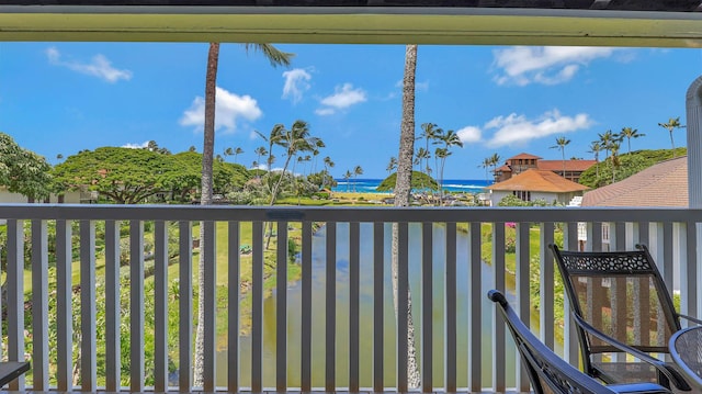 balcony featuring a water view