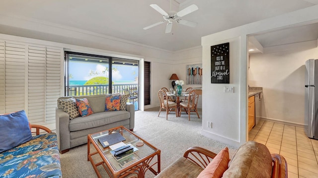 living room featuring light colored carpet and ceiling fan