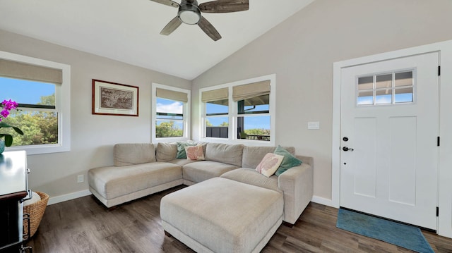 living room featuring ceiling fan, lofted ceiling, a wealth of natural light, and dark wood-type flooring