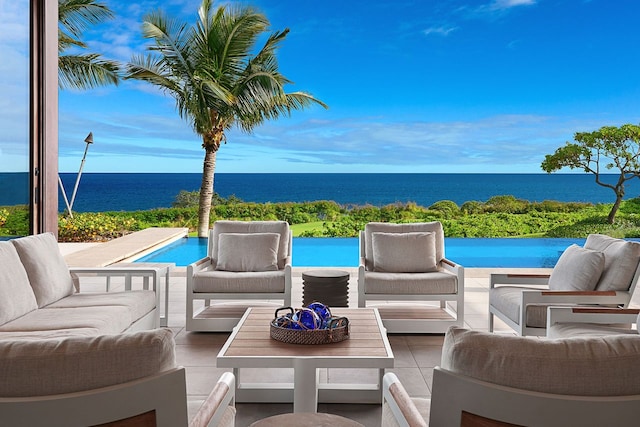 view of patio / terrace with an outdoor living space and a water view