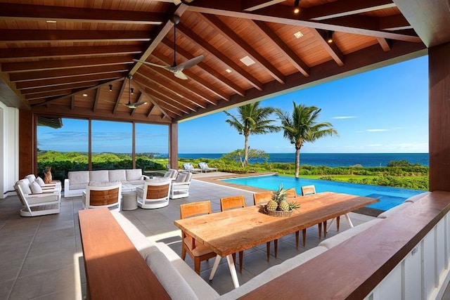 view of patio / terrace with a water view, ceiling fan, a gazebo, and an outdoor hangout area