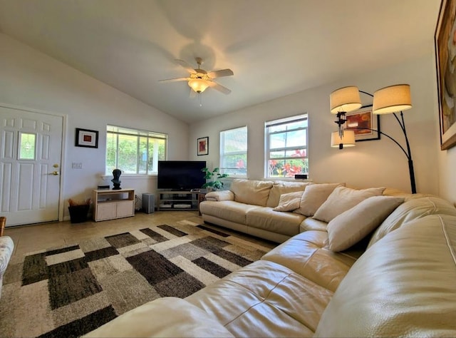 tiled living room featuring a wealth of natural light, lofted ceiling, and ceiling fan