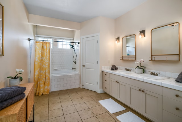bathroom with vanity, tile patterned floors, and shower / bath combo with shower curtain