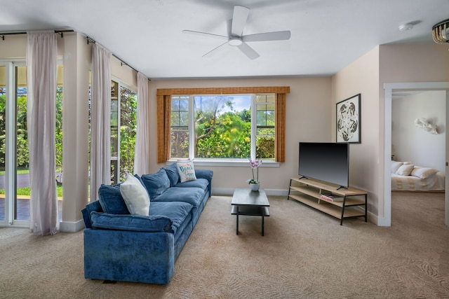 living room with ceiling fan and light carpet