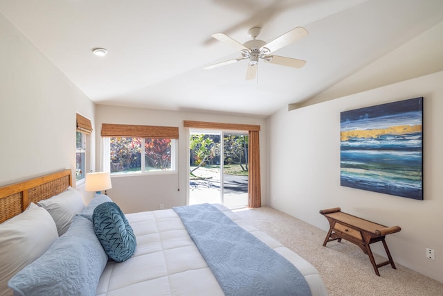 carpeted bedroom with access to outside, ceiling fan, and vaulted ceiling