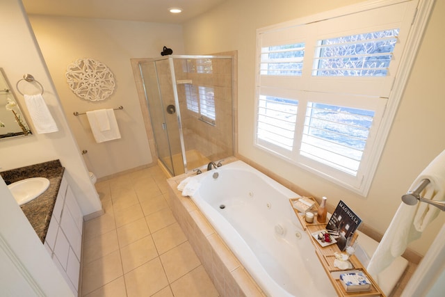 full bathroom featuring tile patterned floors, vanity, plenty of natural light, and shower with separate bathtub