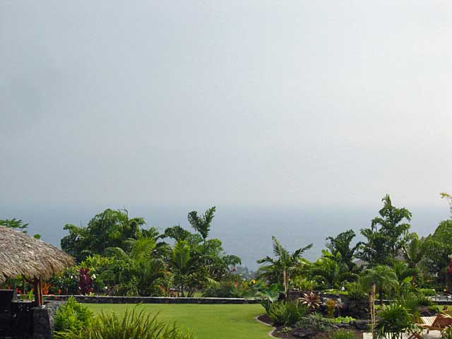 view of property's community with a water view and a yard