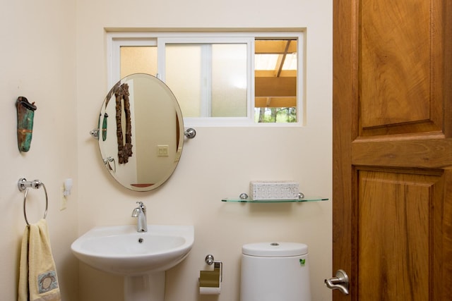 bathroom featuring sink and toilet