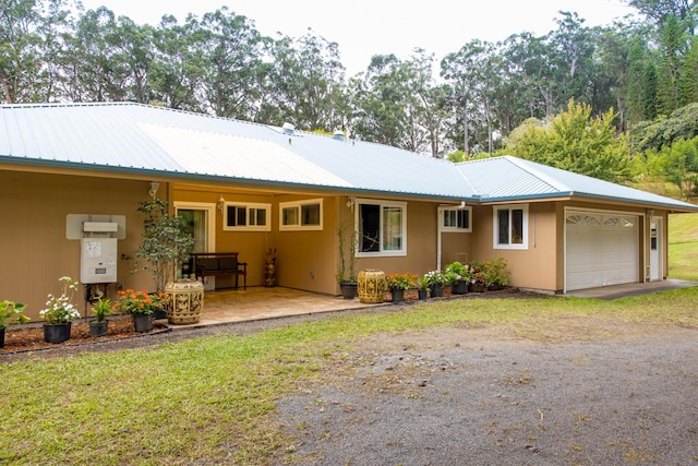 rear view of house with a garage