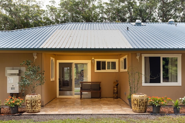 back of property with a patio area