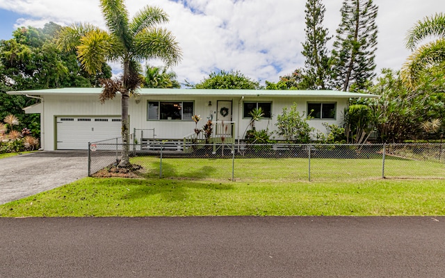 ranch-style home with a garage and a front yard