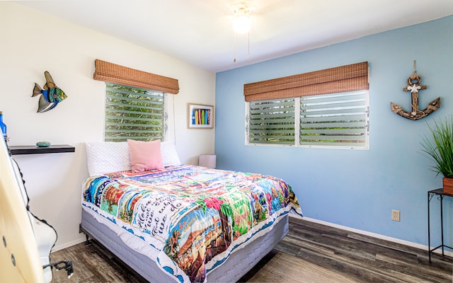 bedroom with hardwood / wood-style flooring and ceiling fan