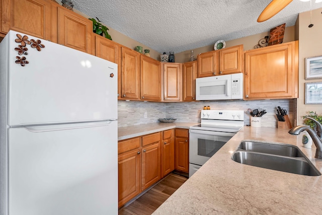 kitchen featuring backsplash, ceiling fan, dark wood-type flooring, sink, and white appliances