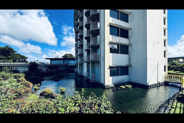 view of building exterior with a water view