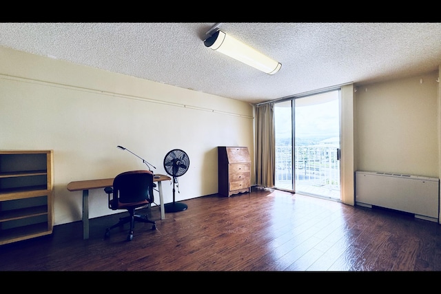 home office with radiator, a textured ceiling, dark hardwood / wood-style floors, and floor to ceiling windows