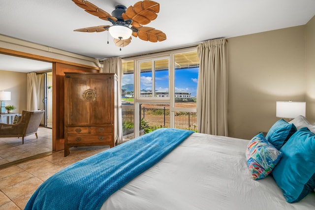 tiled bedroom featuring access to outside and ceiling fan