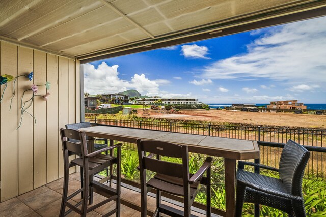 balcony featuring a water view