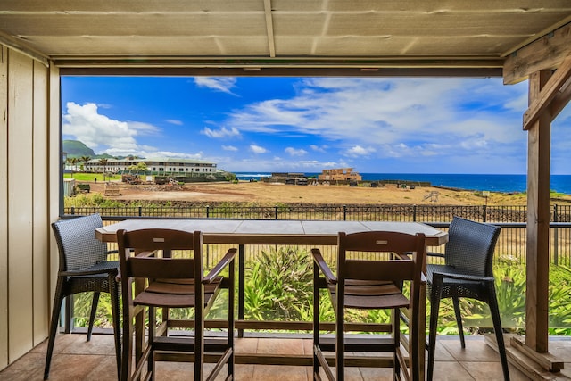 balcony featuring a water view