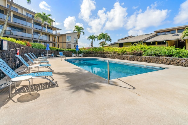 view of swimming pool with a patio