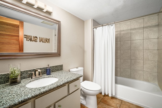 full bathroom with vanity, tile patterned flooring, toilet, shower / bath combo with shower curtain, and a textured ceiling