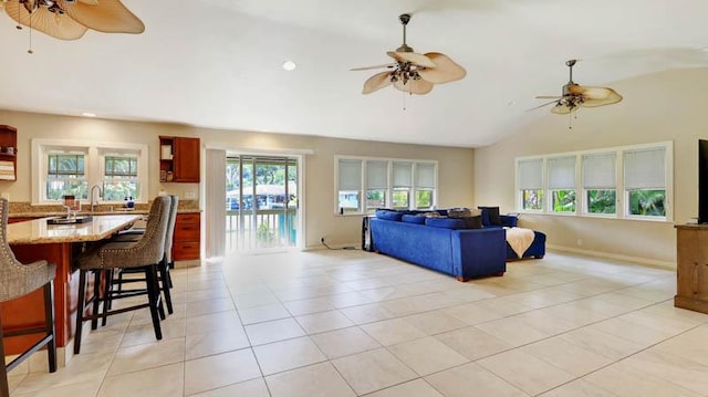 tiled living room with lofted ceiling